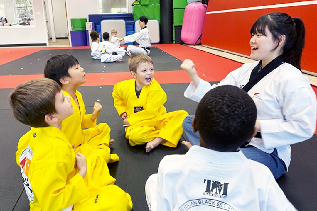 Instructor teaching young students in a positive and fun martial arts class at ABBA Martial Arts in Newnan.