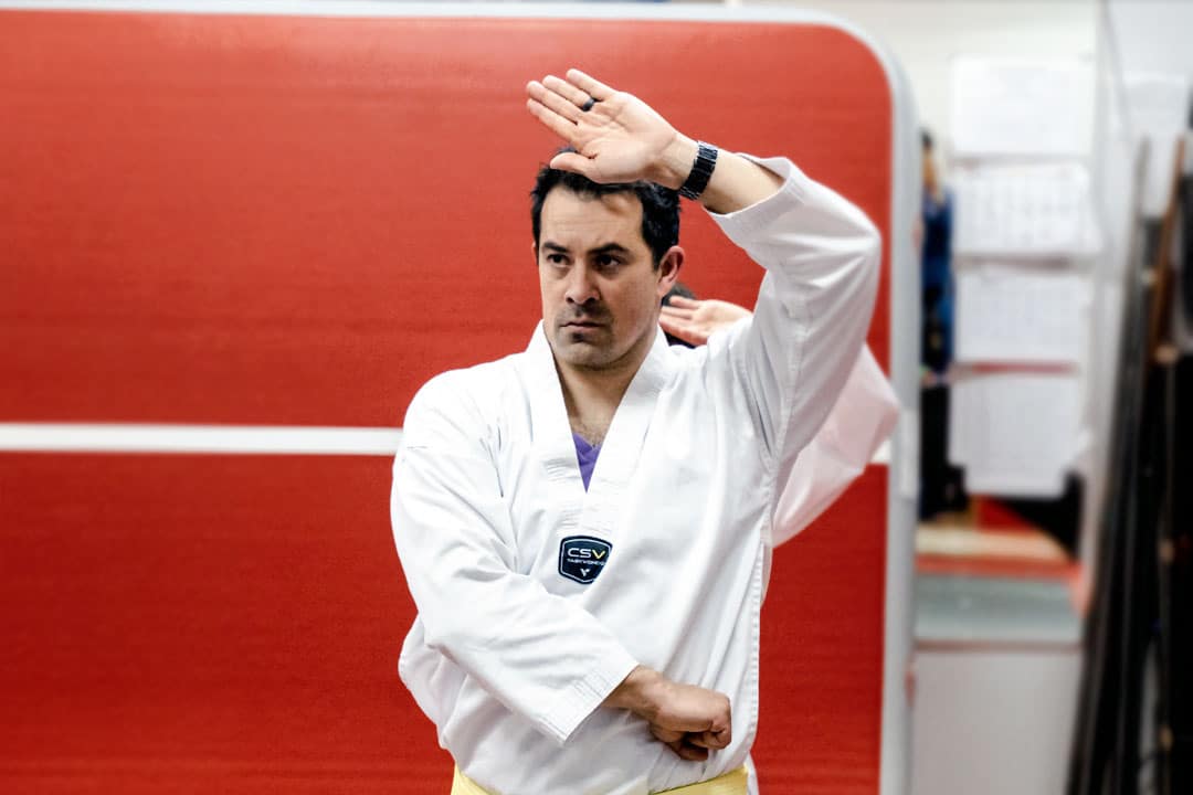 Structured Adult Martial Arts Training in Peachtree City Adult martial arts student practicing traditional Taekwondo technique at ABBA Martial Arts in Peachtree City